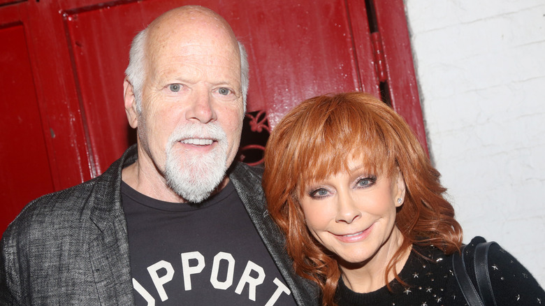 Reba McEntire and Rex Linn posing together