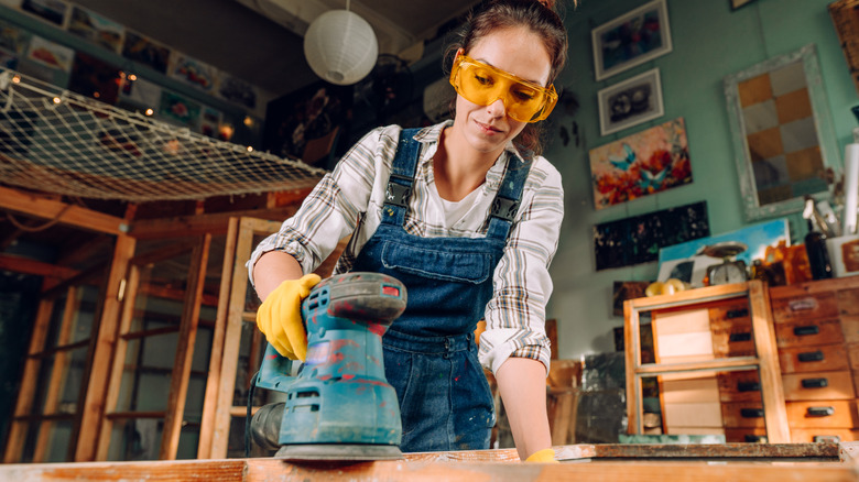woman with sander