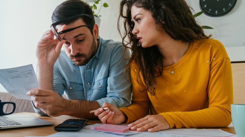 stressed couple budgeting