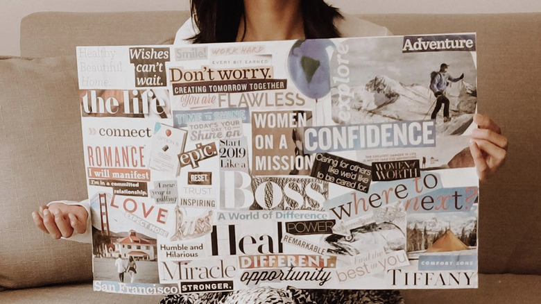 Woman holding a vision board