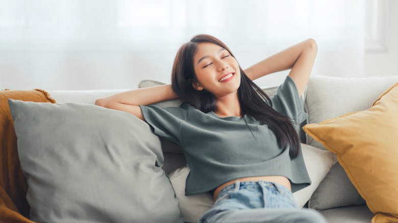 Woman relaxing on couch