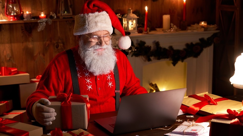 Santa on laptop tracking gifts