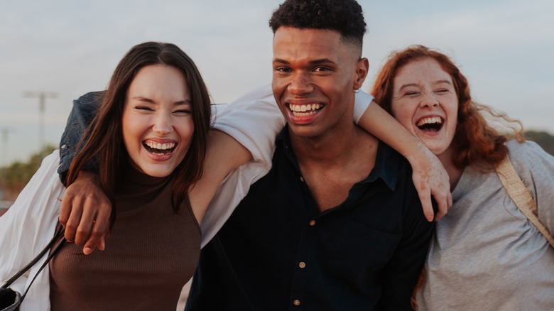 three friends laughing