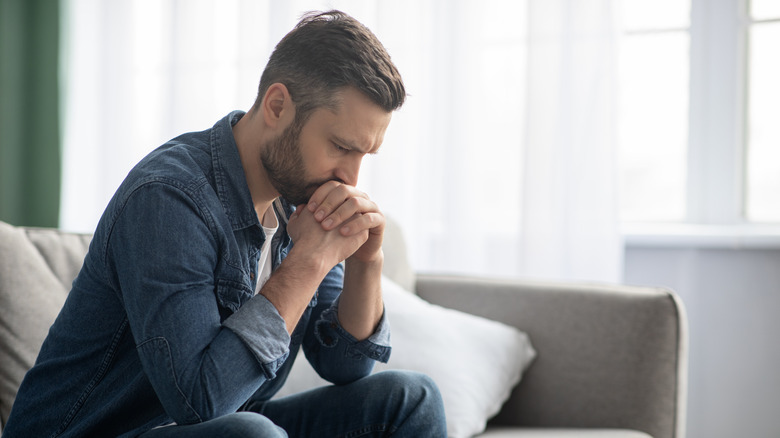 sad man on couch