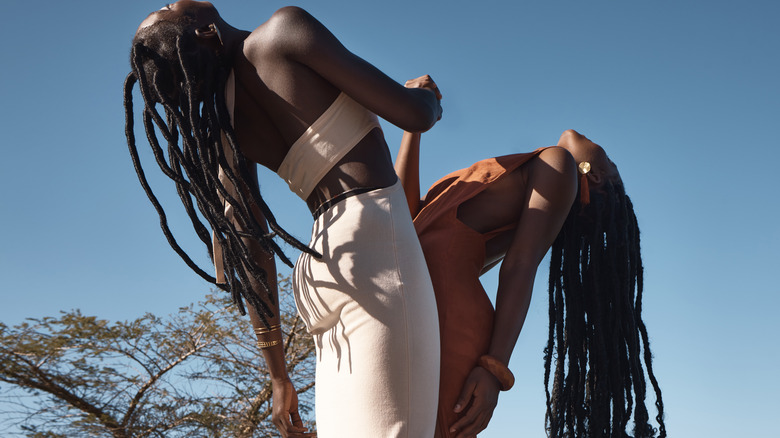 two girls with long locs