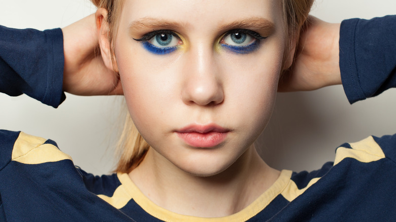 Blonde girl with blue eye makeup 
