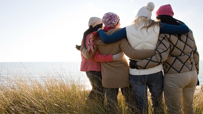 Group of friends looks out at lake