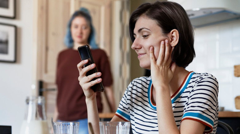 woman holding phone