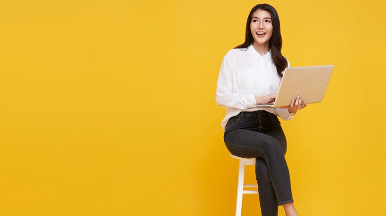 woman sitting with laptop