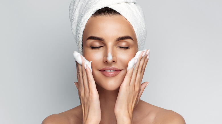 woman washing face