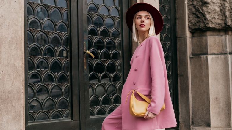 Woman wearing pastel pink pantsuit 