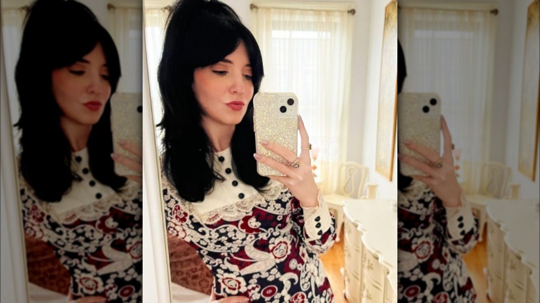 A woman with curtain bangs