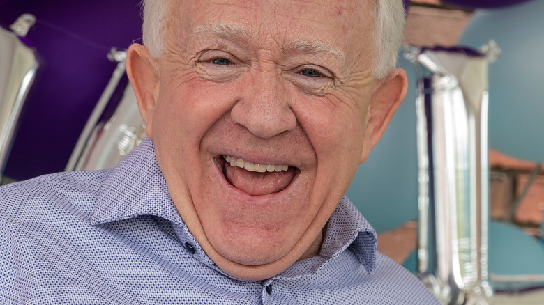 Leslie Jordan smiling in front of balloons