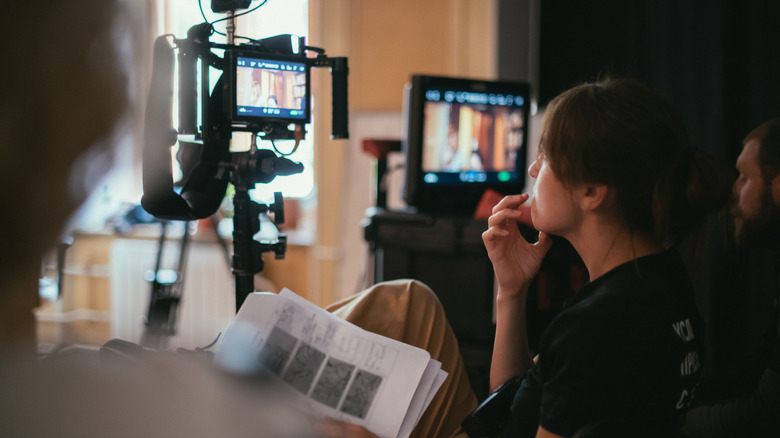 A woman behind a camera
