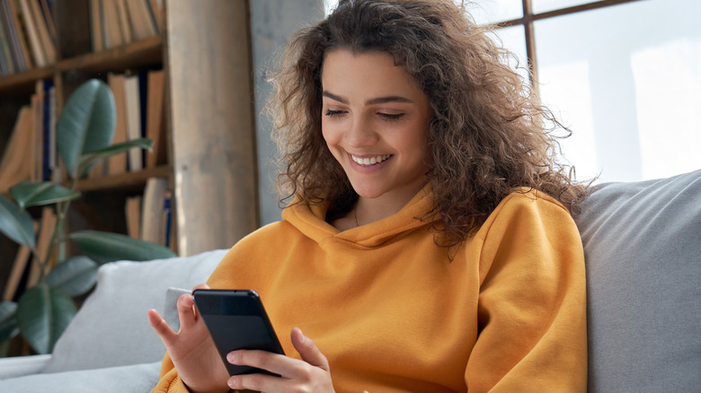 woman holding phone