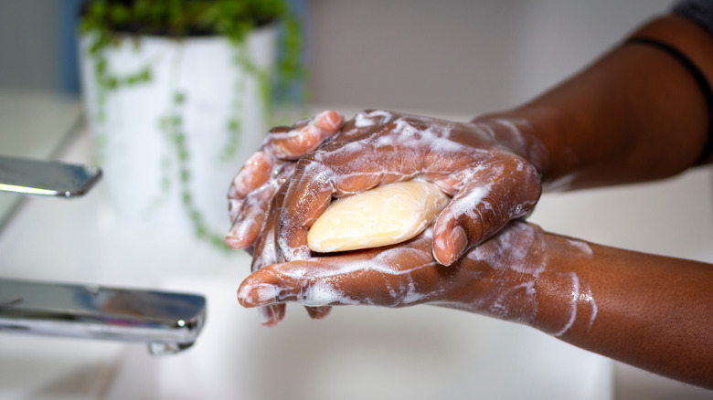 person washing their hands