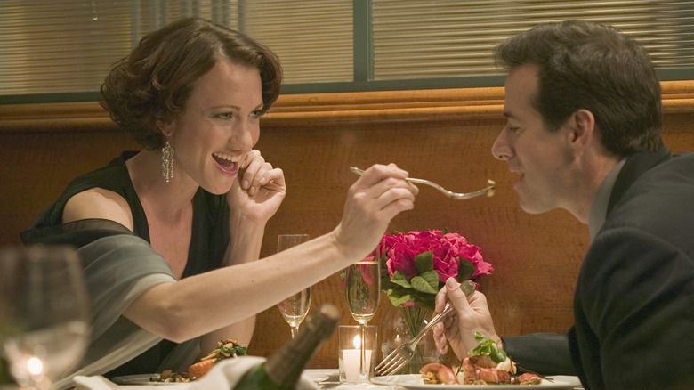 woman feeding man