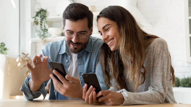 couple using phones