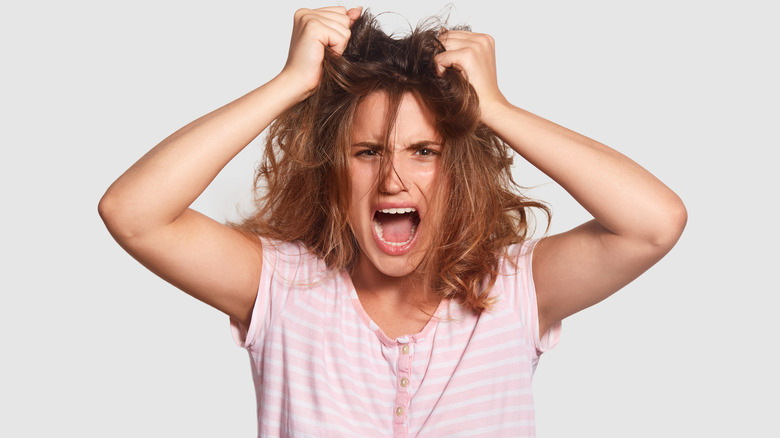 Stressed woman with messy hair