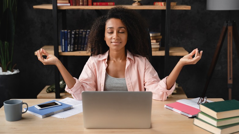 Woman meditating at desk