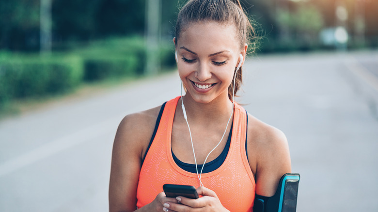 runner looking at phone