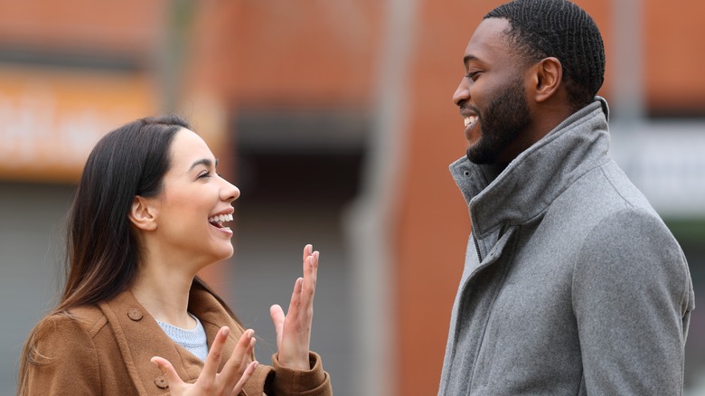 man and woman talking