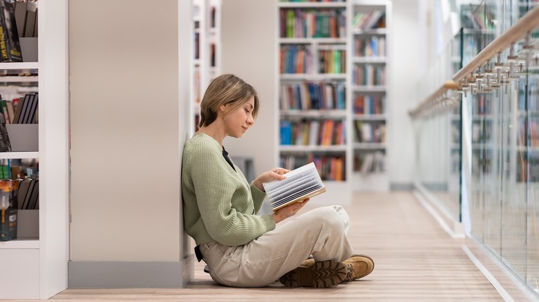 woman reading on the floor