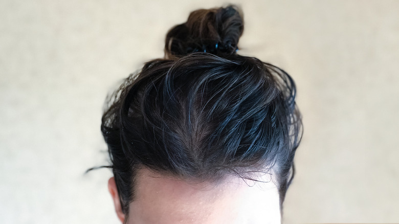 Greasy hair in bun