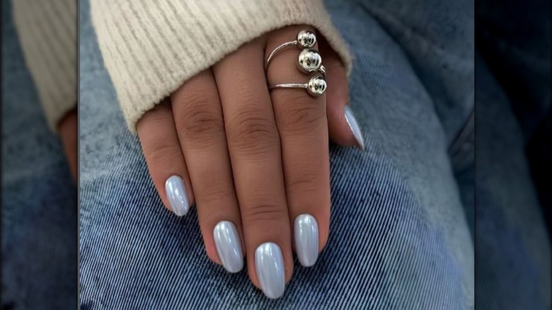 Woman with icy blue nails