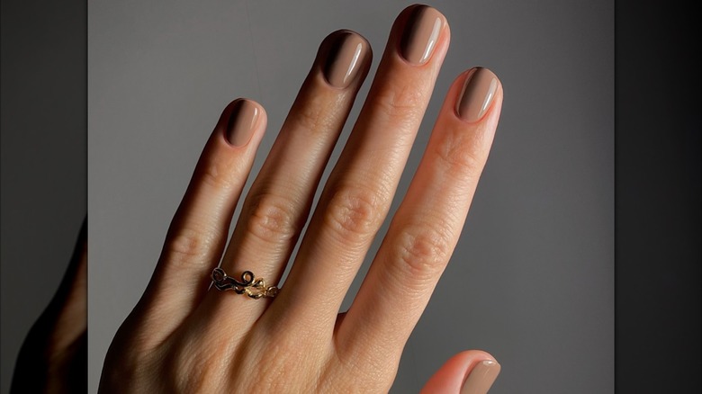 Woman with burgundy nails