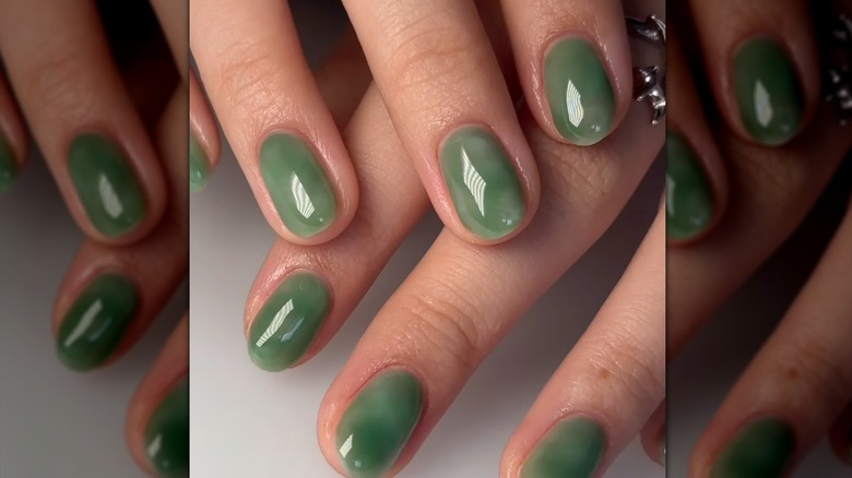 Woman with jade green manicure