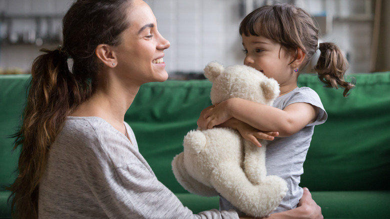 child with teddy bear