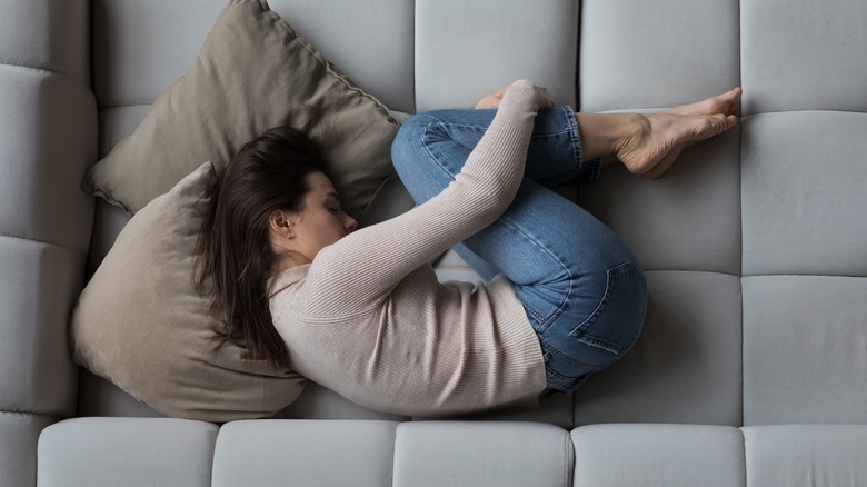 Woman laying on couch