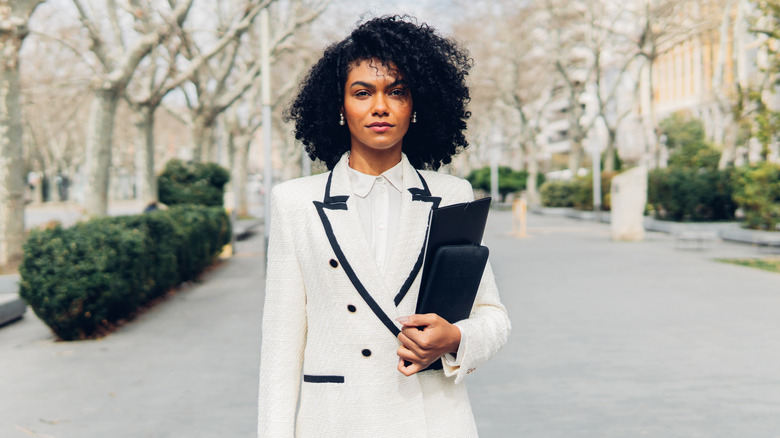 Woman poses in fashionable suit