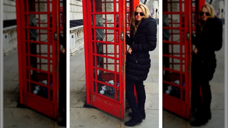 Tricia McLaughlin stands near a phone booth in England