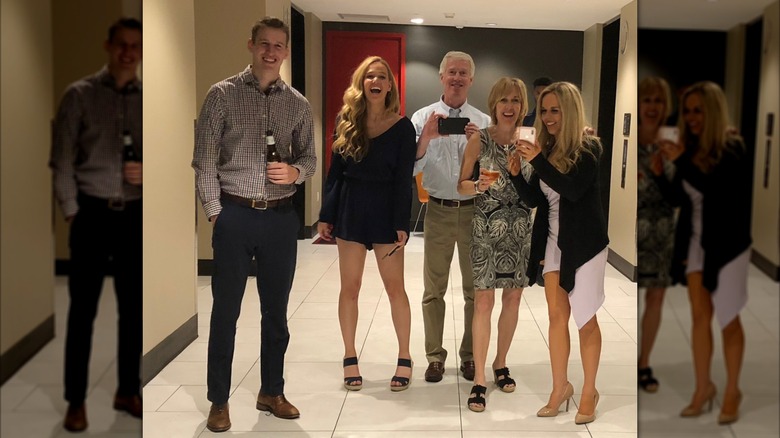 Tricia McLaughlin poses for a photo with her parents and siblings before a night out
