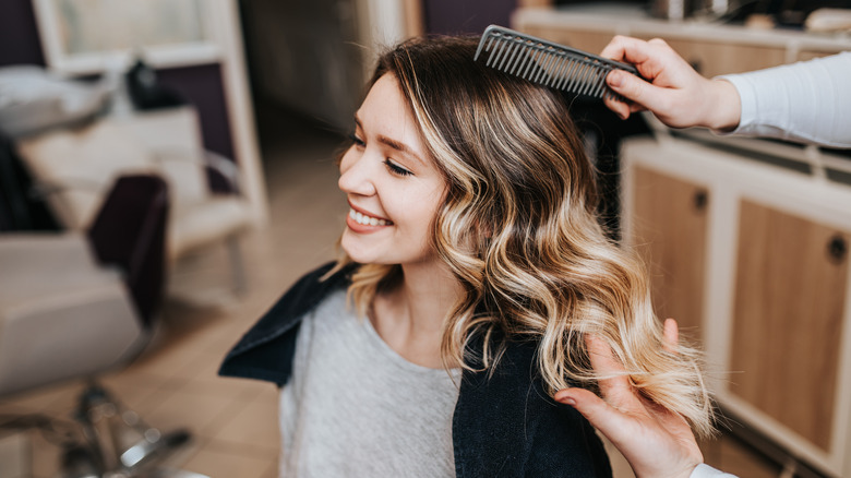 Woman getting her hair highlighted.