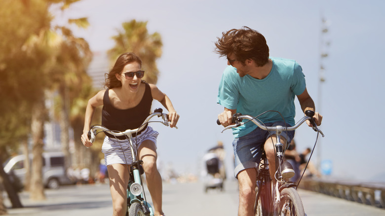 Man and woman on bikes