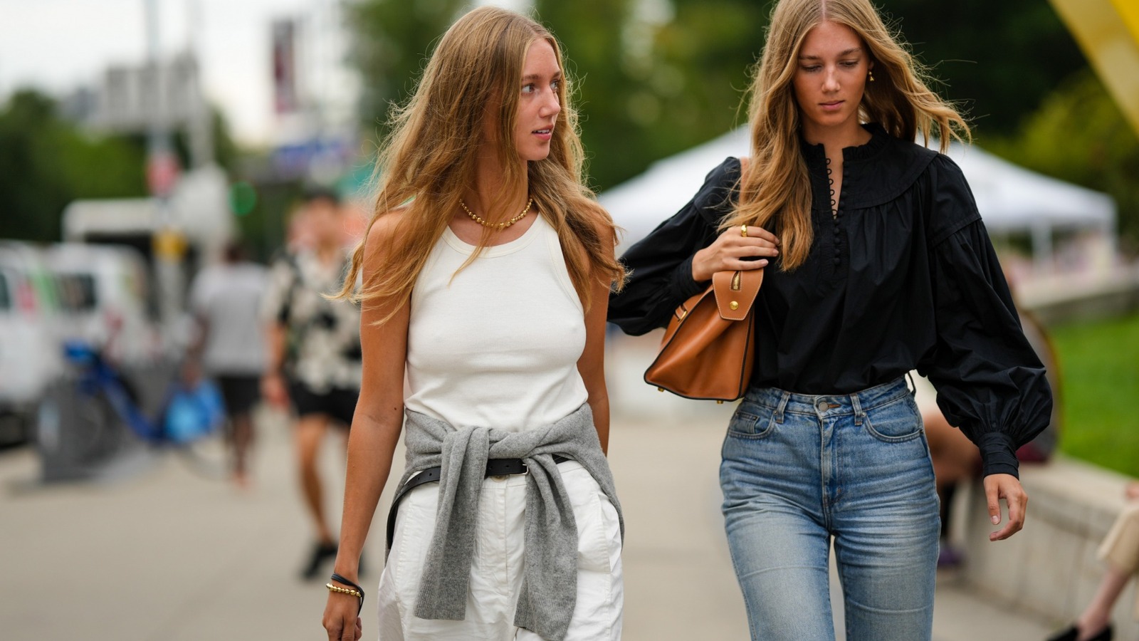 https://www.glam.com/img/gallery/tying-your-sweater-around-your-waist-is-a-fashion-choice-now-our-tips-to-style-the-trend/l-intro-1698127226.jpg?utm_source=chatgpt.com