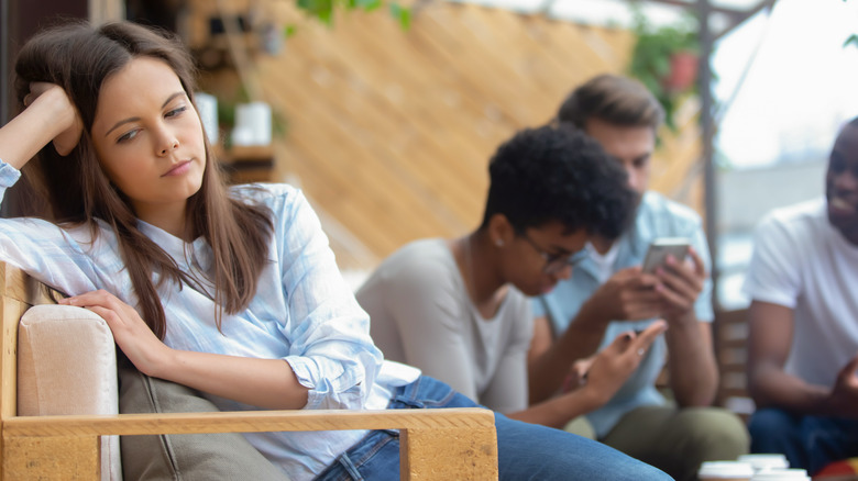 unhappy woman with friends