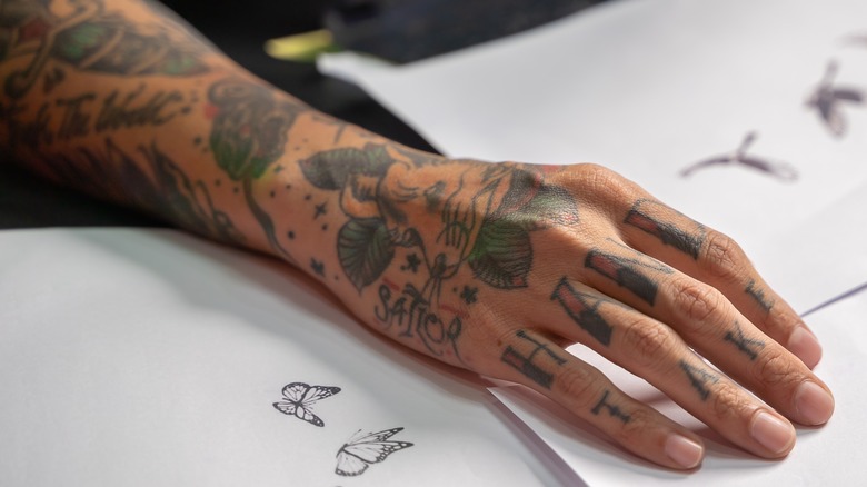 arm with older tattoos