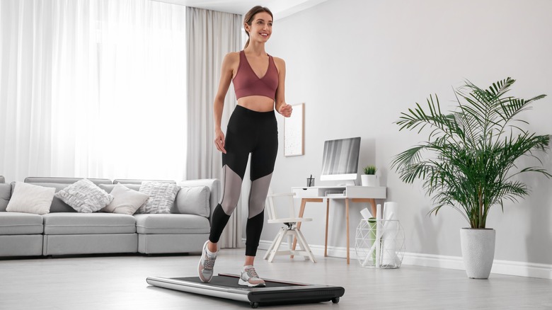 woman walking on walking pad 