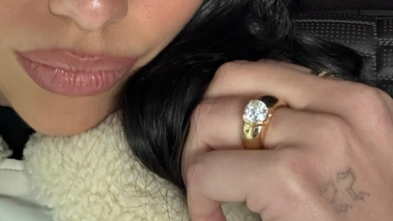 Dua Lipa posted this selfie in a white warm winter coat on her Instagram in February 2025.