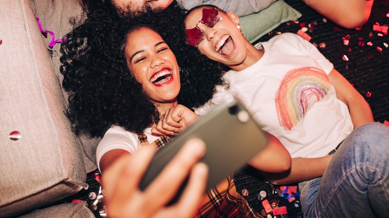 group of women taking group selfie