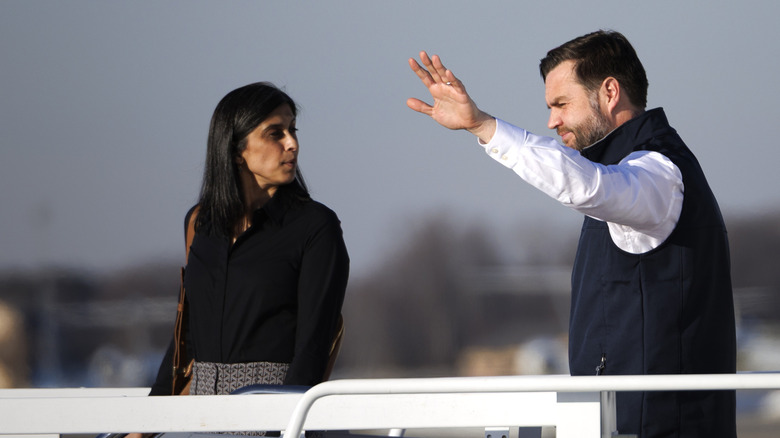 Usha Vance looking at JD Vance waving