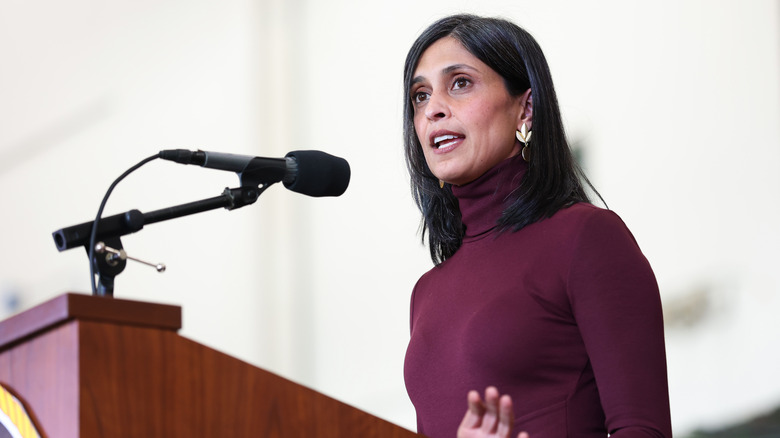 Usha Vance in a burgundy dress