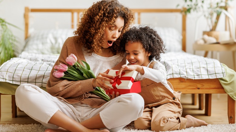 Woman opening Mother's Day gifts