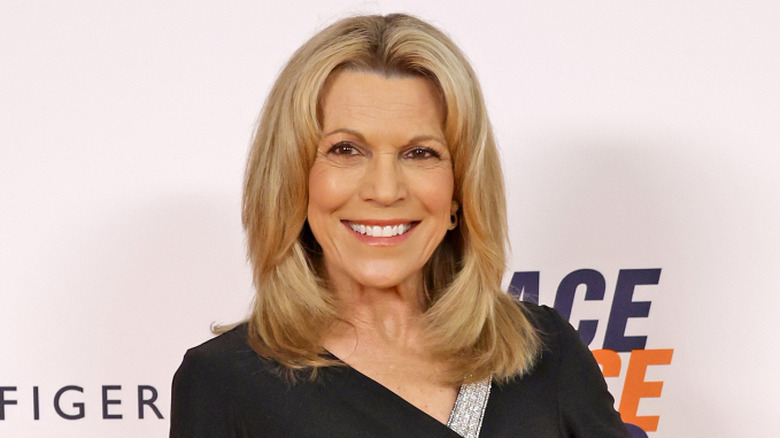 Vanna White wearing a black long-sleeved dress