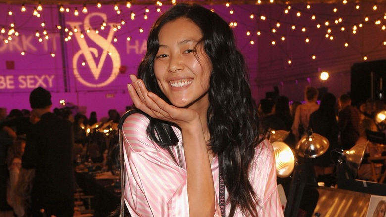 Model Liu Wen backstage in hair and makeup ahead of the 2009 Victoria's Secret Fashion Show in New York City in November 2009