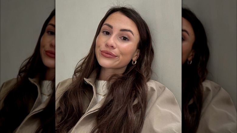 Woman with brown hair taking selfie